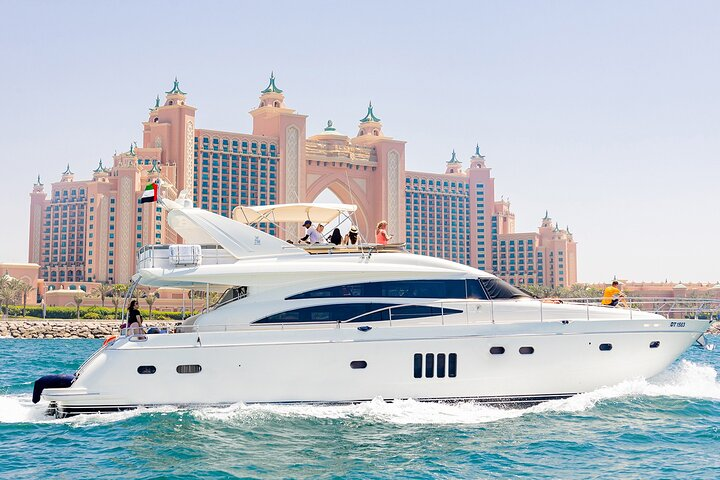 Experience Dubai's stunning coastline from the deck of a luxurious yacht savoring delicious BBQ and drinks while taking in iconic landmarks like the Burj Al Arab and Atlantis.
